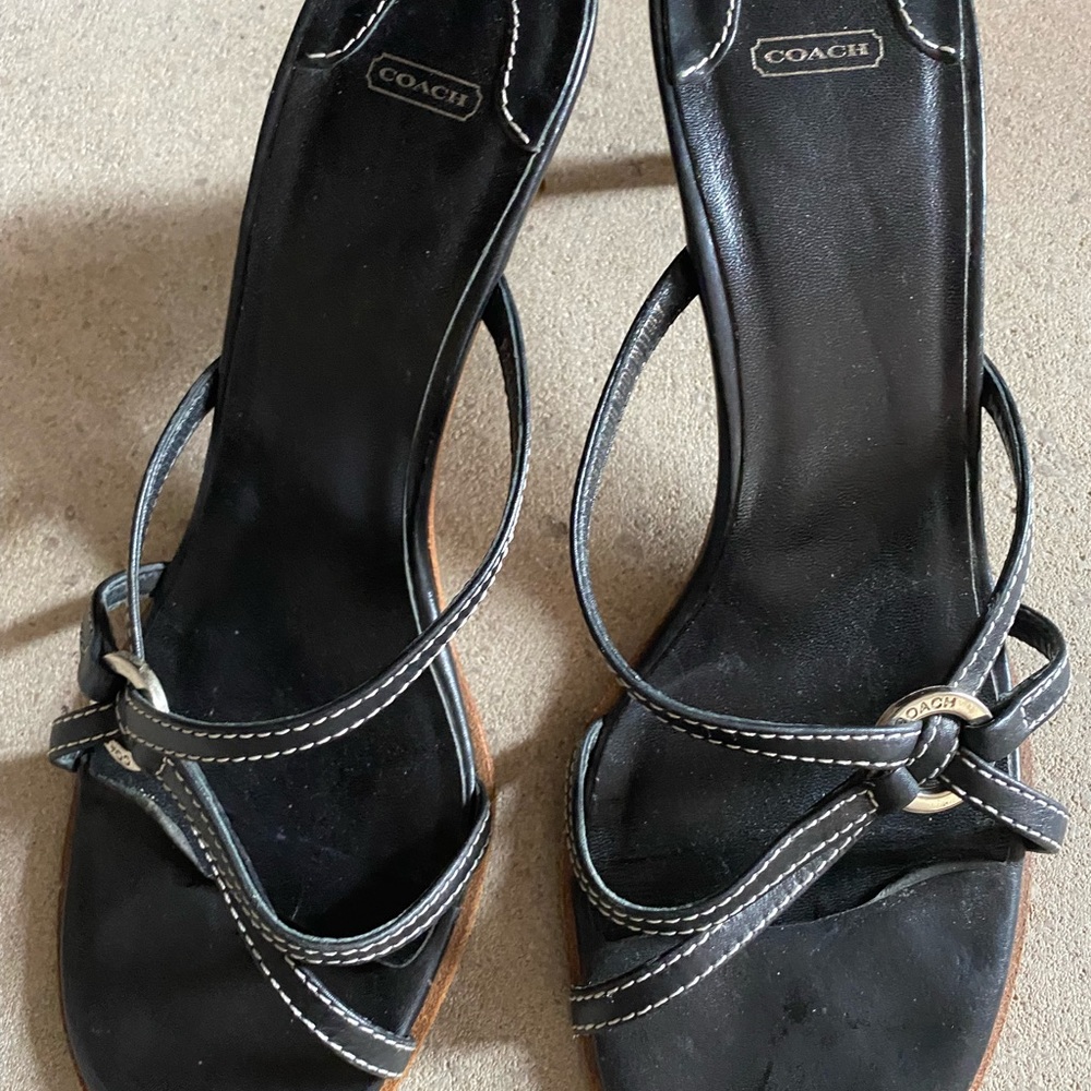 Leather with approx. 3 inch heel, silver hardware.